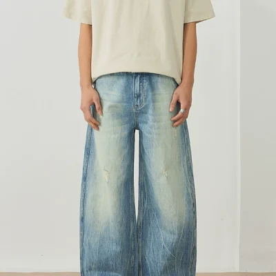 Model wearing trendy men's baggy wide-leg jeans with lightning pattern